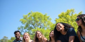 People laughing in a sunny park